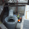 Crew members grouting 60-inch pipe at drop shaft 5.