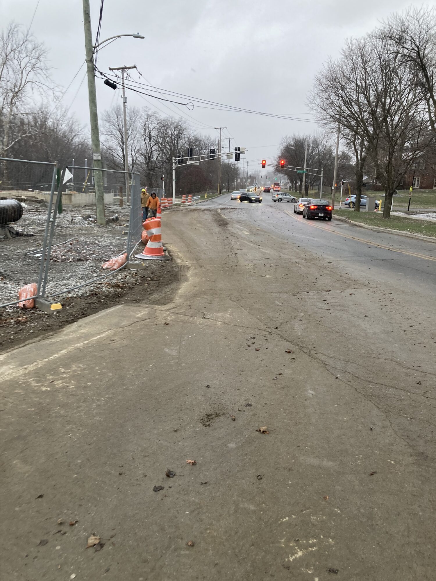 Photo showing Old Mill Road open to three lanes of traffic.