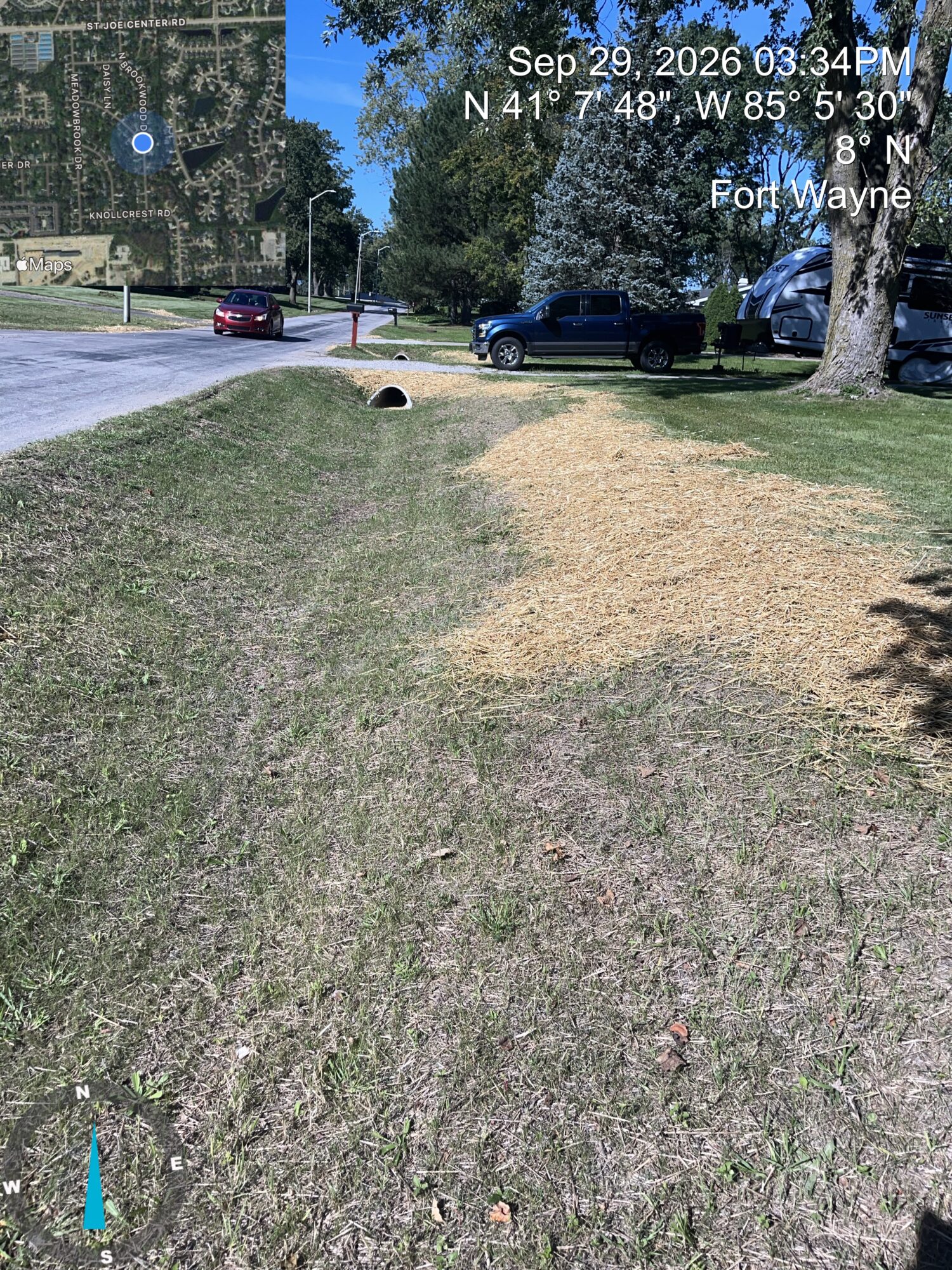 Straw on grass by ditch for restoration