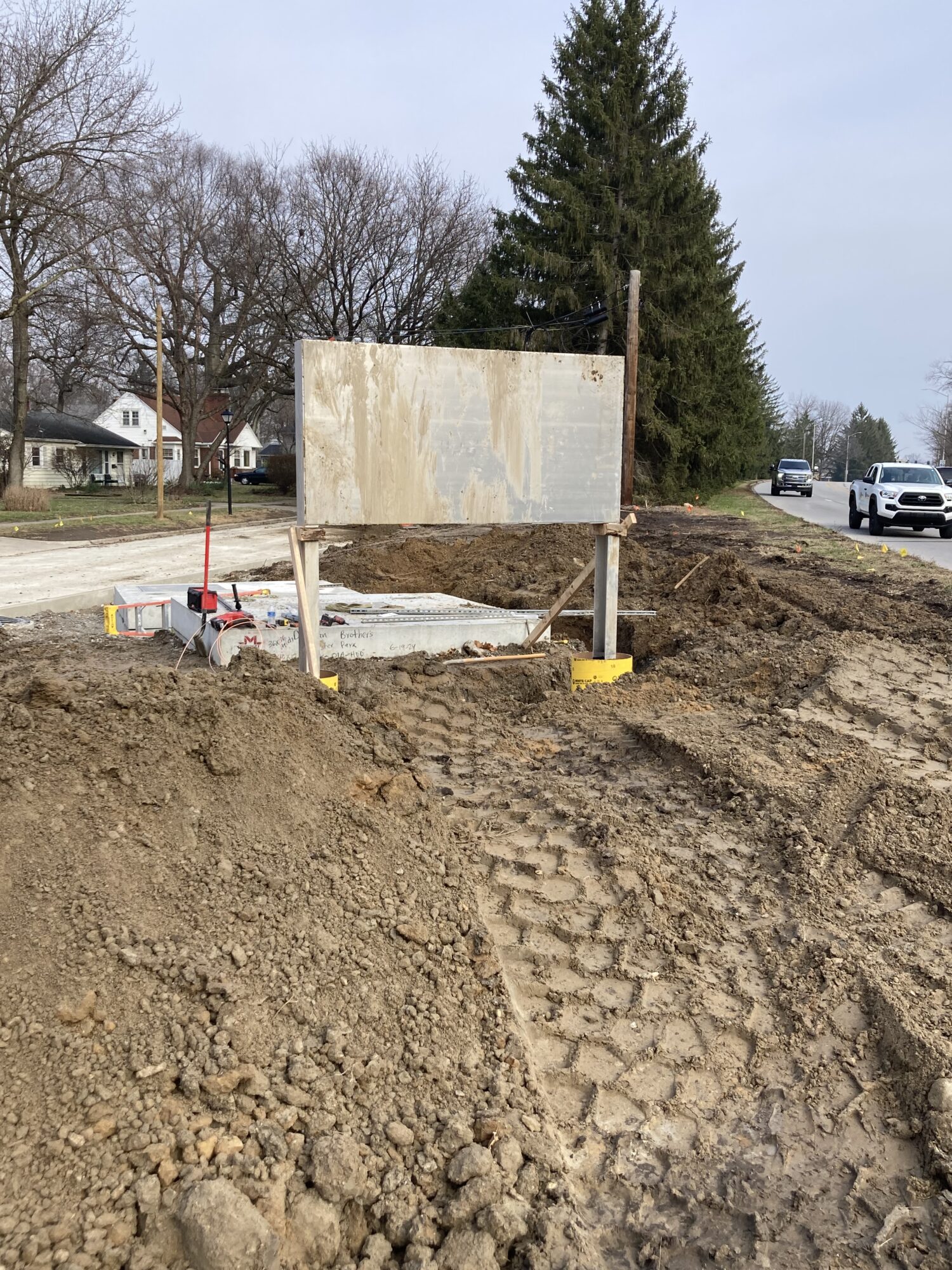 Assembly of a structure meant for the Foster Park Relief sewer in a paved pathway.