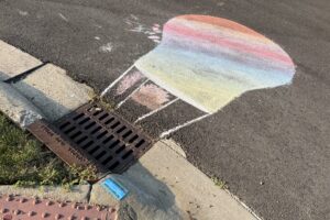 IMG_0684 Chalk drawing of a hot air balloon next to a storm drain.