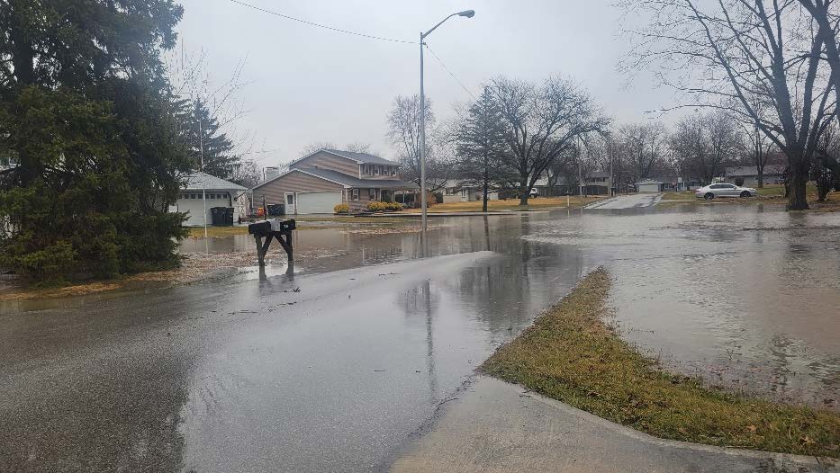 Image of Tamarack Neighborhood street flooding with water.