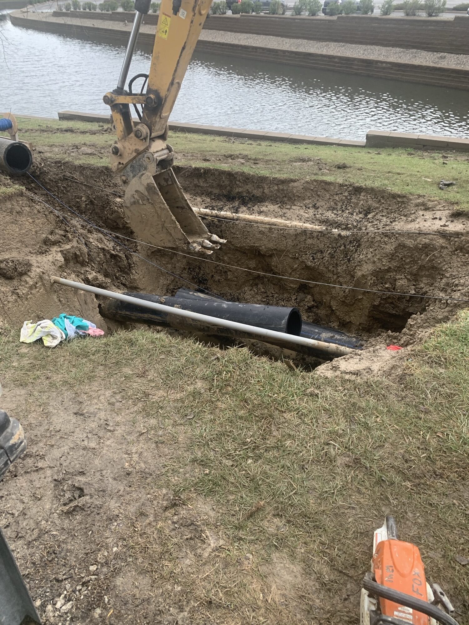 View of a dug out with water main pipes being fused together.