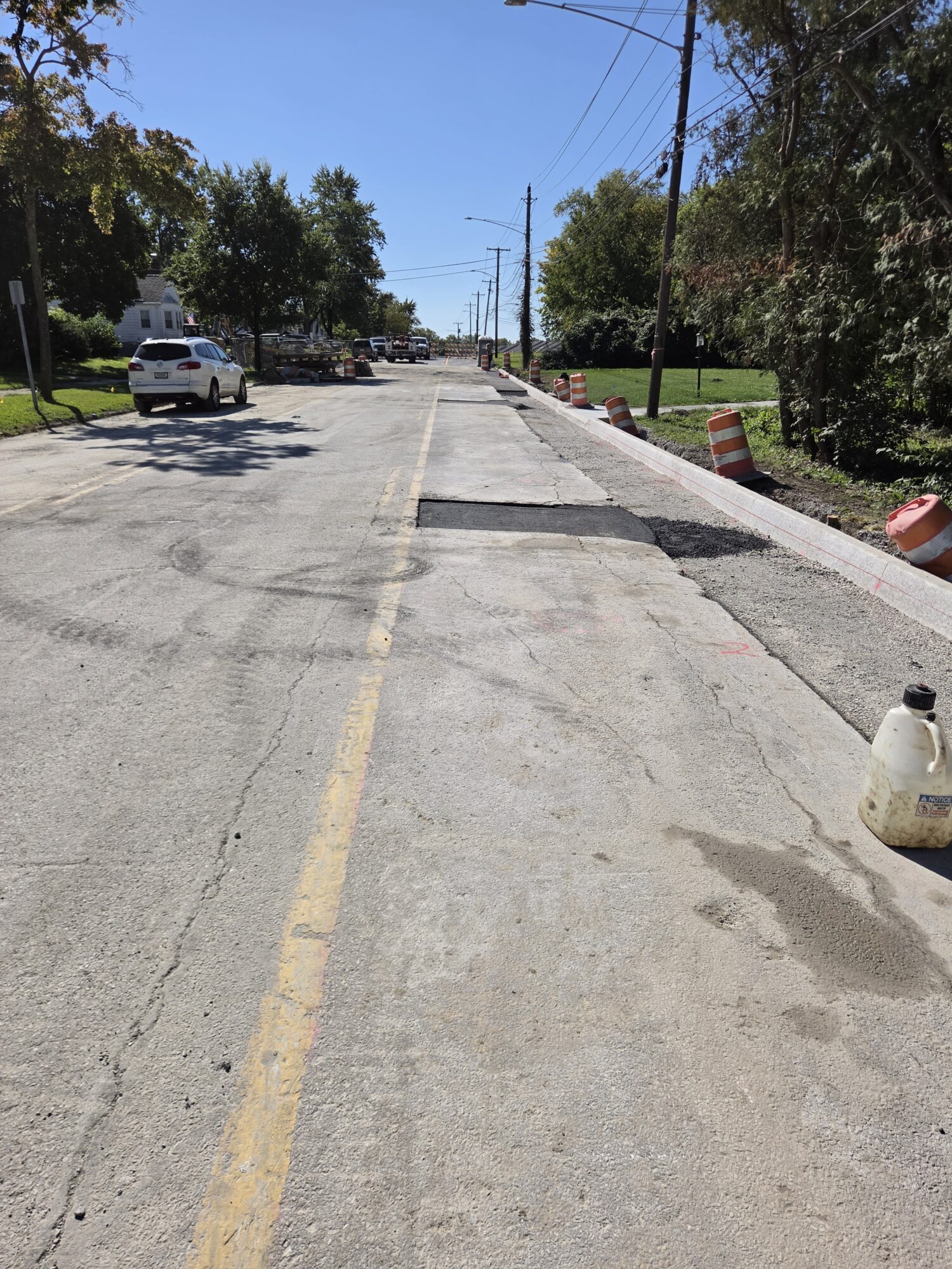 A street with new asphalt patchwork.