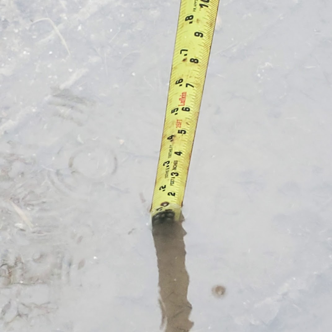 Ruler measuring depth of flood